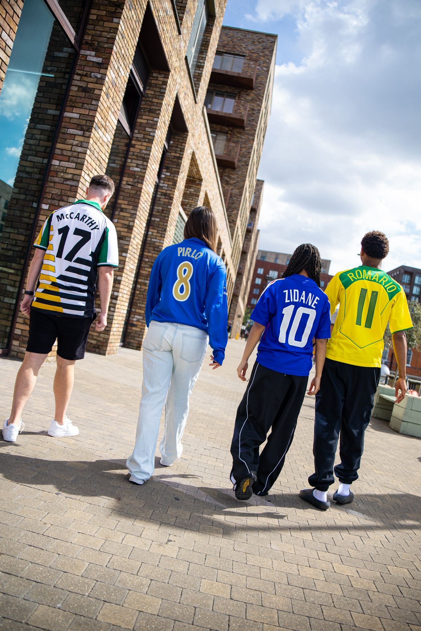 Football shirt collectors walking together in vintage-inspired shirts